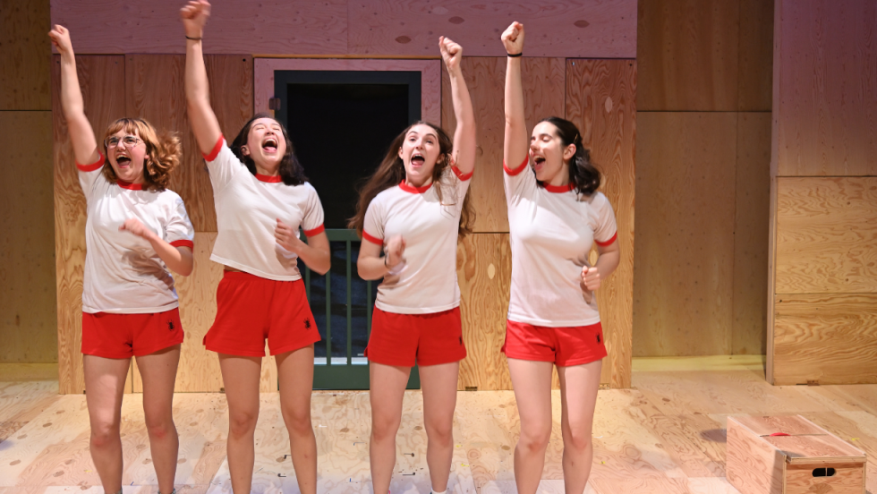 4 young women celebrating.