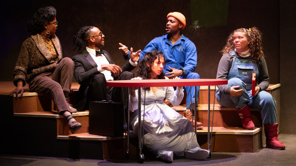A group of people sitting around a table 